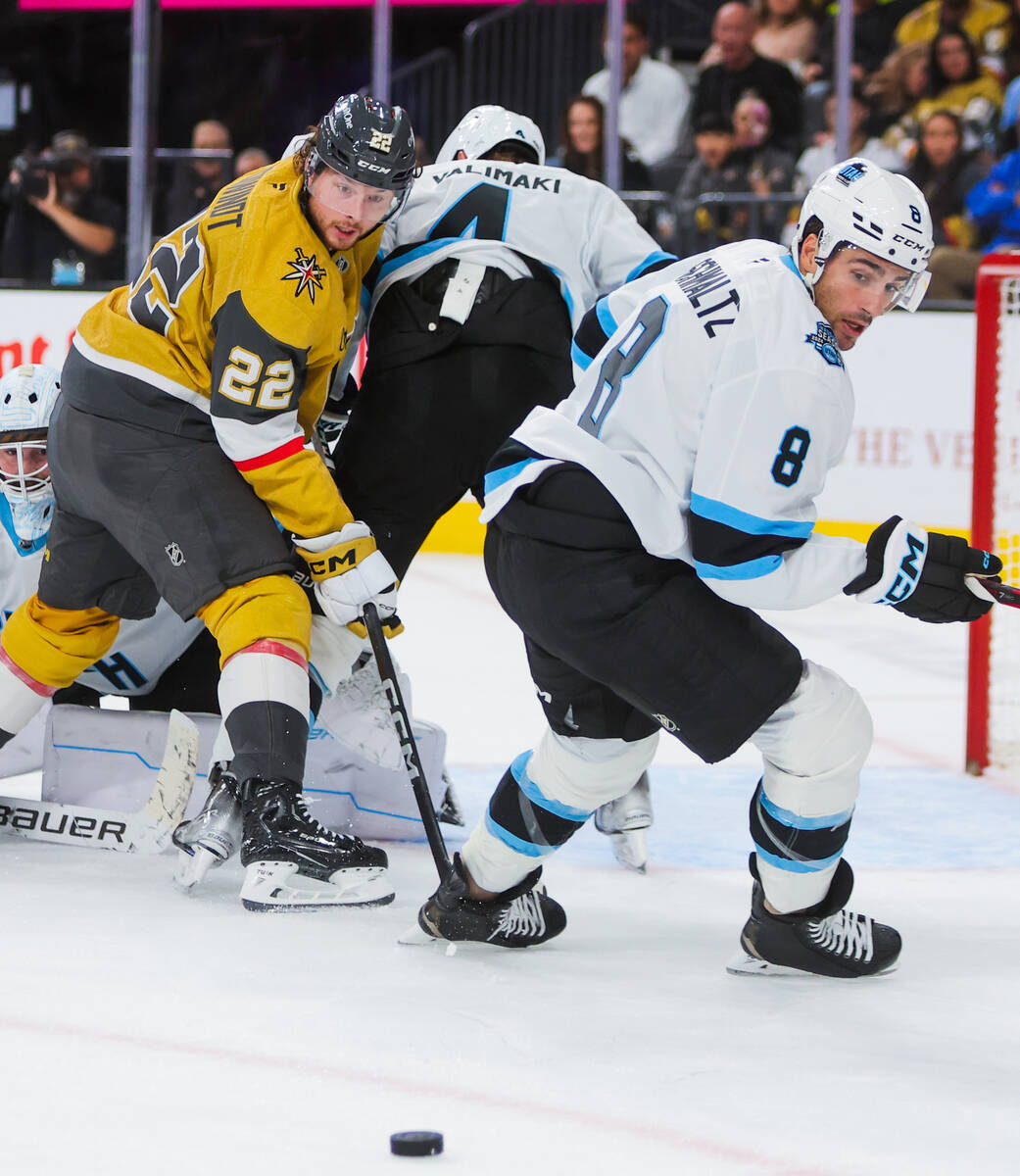 Golden Knights right wing Cole Schwindt (22) and Utah Hockey Club center Nick Schmaltz (8) skat ...