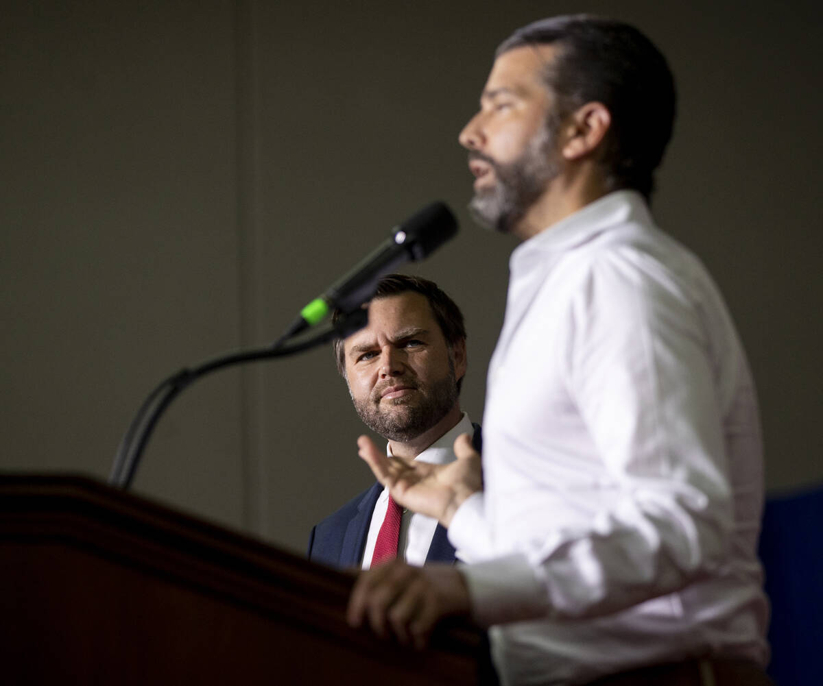 Republican vice presidential nominee Sen. JD Vance, R-Ohio, left, watches Donald Trump Jr., rig ...