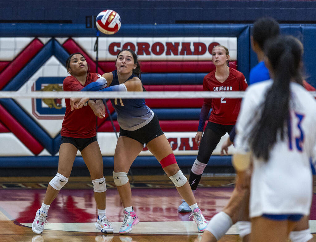 Coronado's Isabelle Guerzon (5) and Reagan Vint (11) work together for a return back to Bishop ...