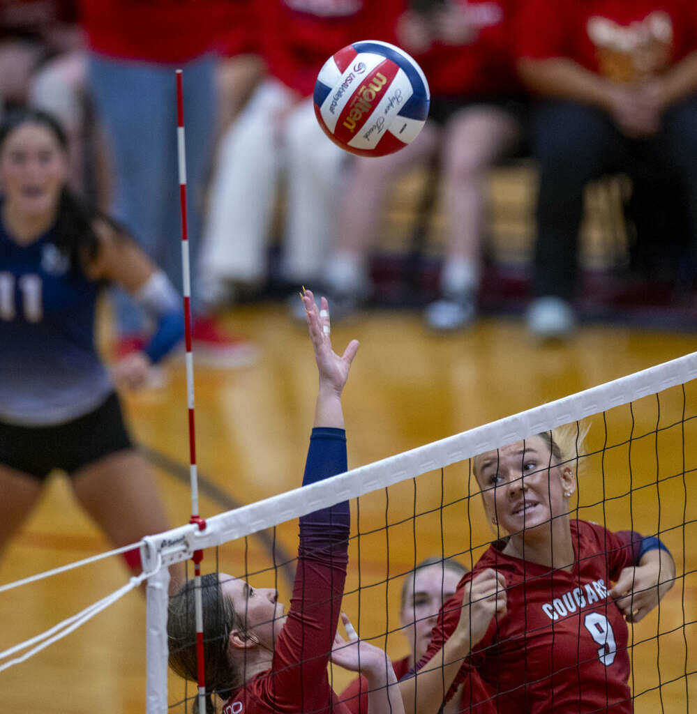 Coronado's Rachel Schwartz (10) attempts a return back to Bishop Gorman with teammate Rachel Pu ...