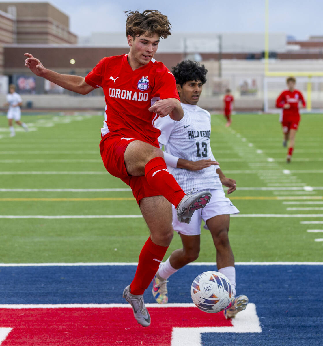 Coronado striker Gavin Flickinger (11) takes a shot at the goal with Palo Verde wing back Haydn ...