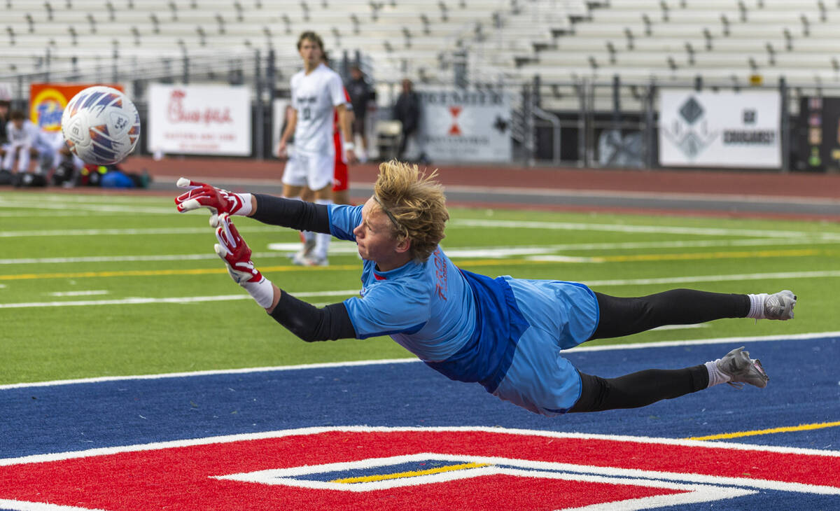 Palo Verde goalkeeper Landon Blanchard (1) makes a diving save against Coronado during the firs ...