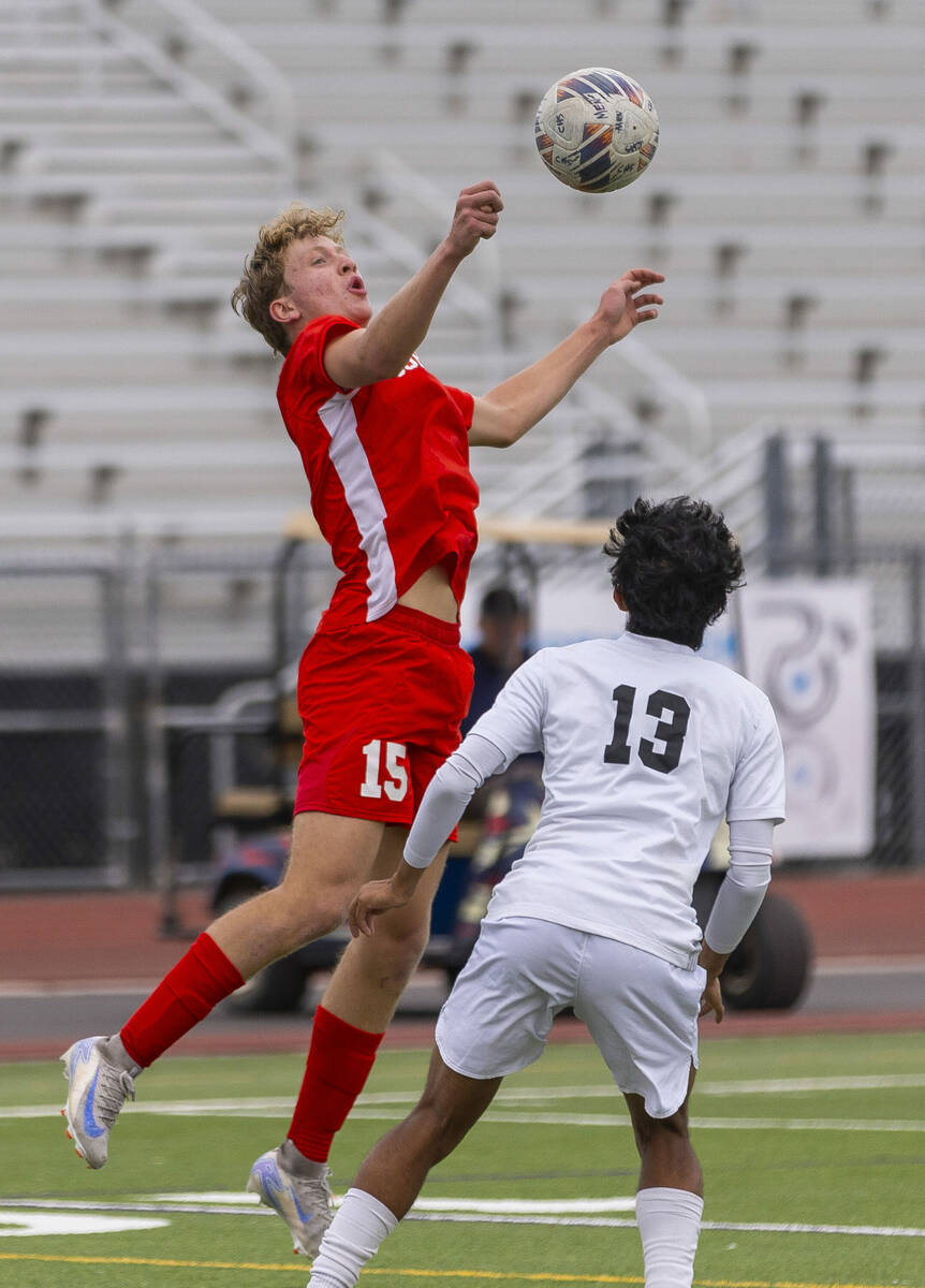 Coronado defender Ben Aronow (15) elevates to control the ball against Palo Verde wing back Hay ...