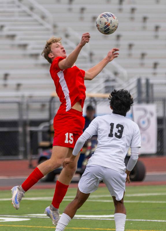 Coronado defender Ben Aronow (15) elevates to control the ball against Palo Verde wing back Hay ...