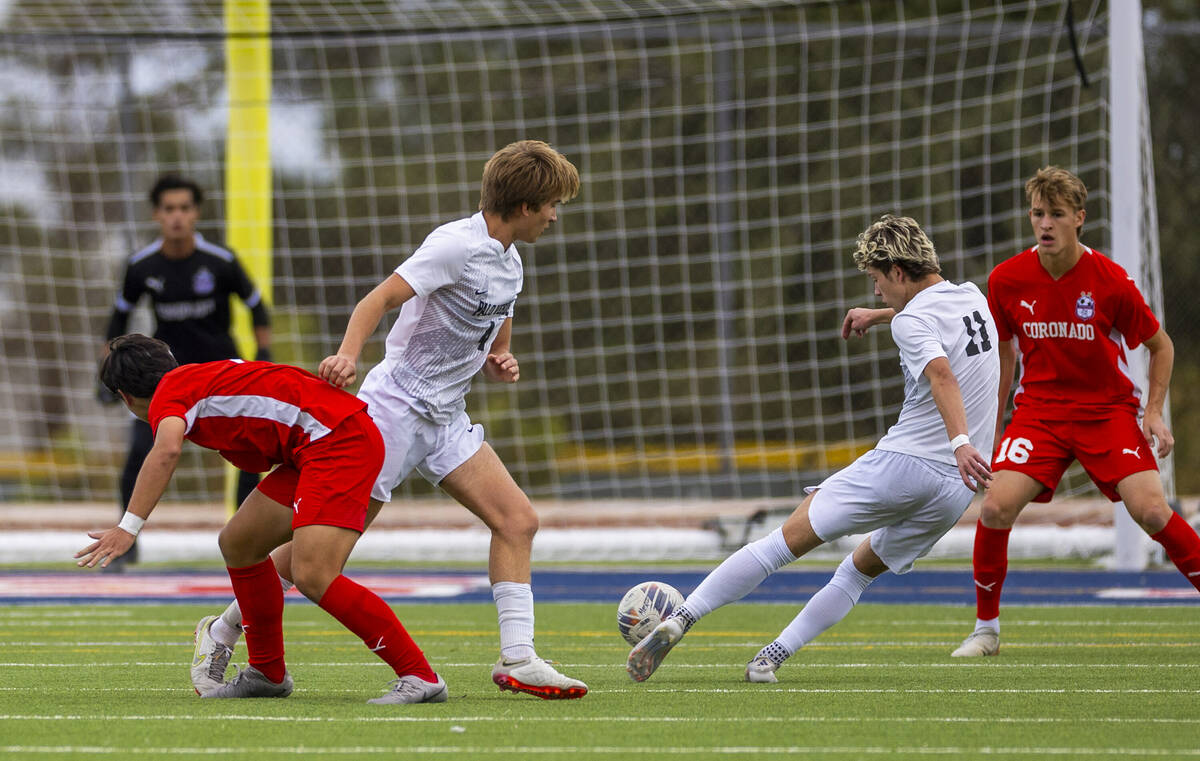 Palo Verde forward Noah Johnson (11) takes a shot at the net as Coronado goalkeeper Logan Pierc ...