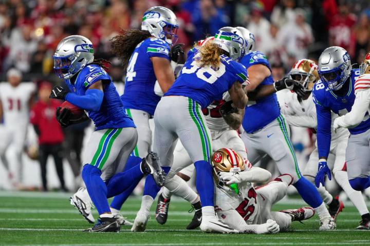 Seattle Seahawks wide receiver Laviska Shenault Jr., left, breaks free to run a kickoff return ...