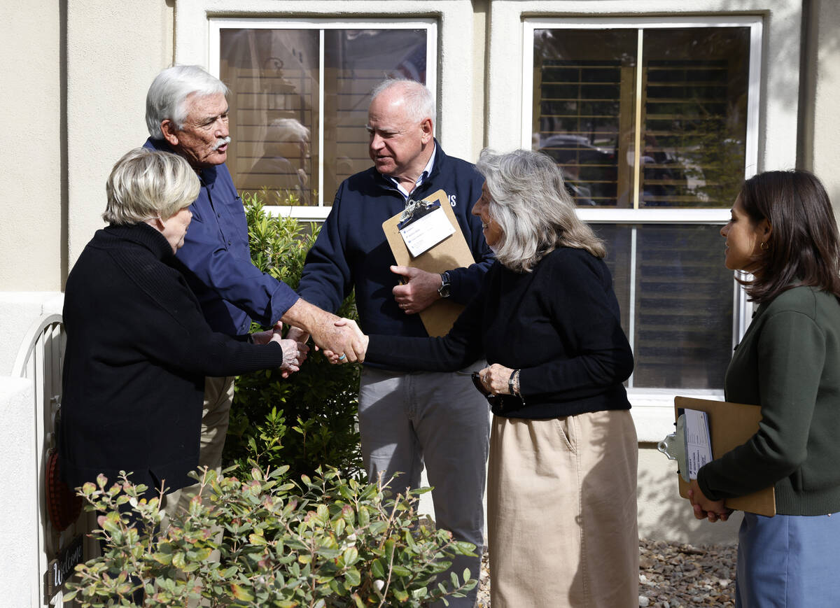 Democratic vice presidential nominee Tim Walz, center, and Rep. Dina Titus, D-Nev., second righ ...