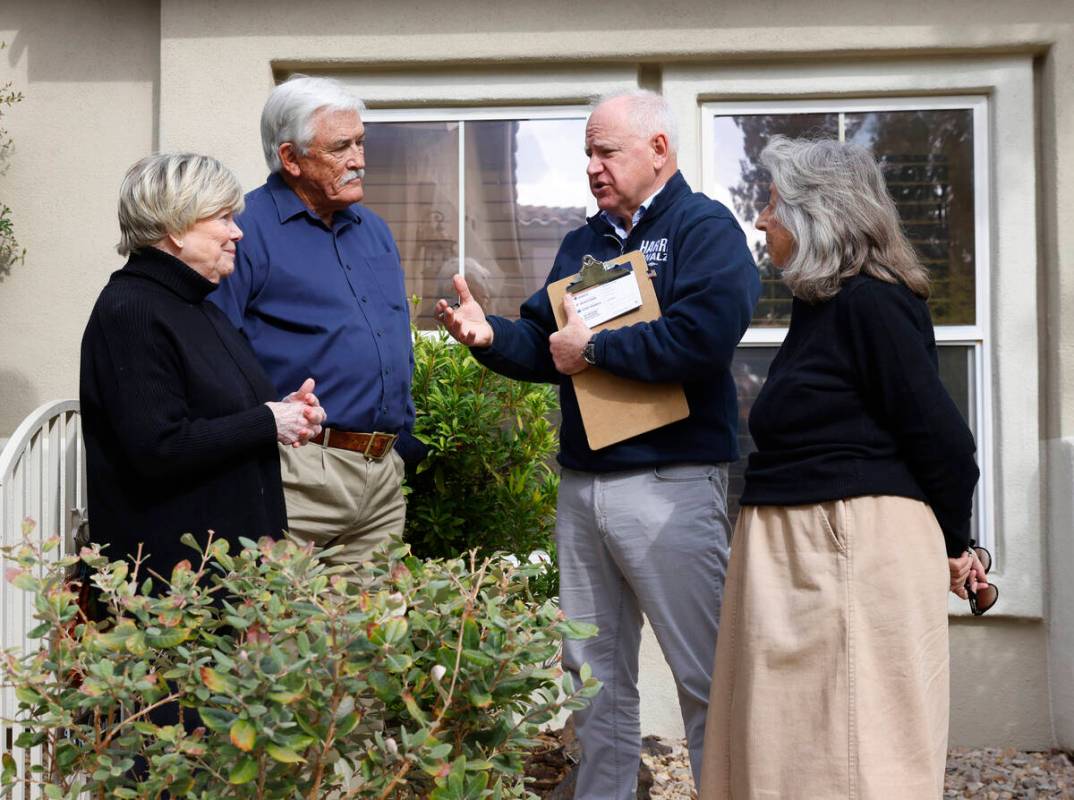 Democratic vice presidential nominee Tim Walz talks to supporters as Rep. Dina Titus, D-Nev., r ...