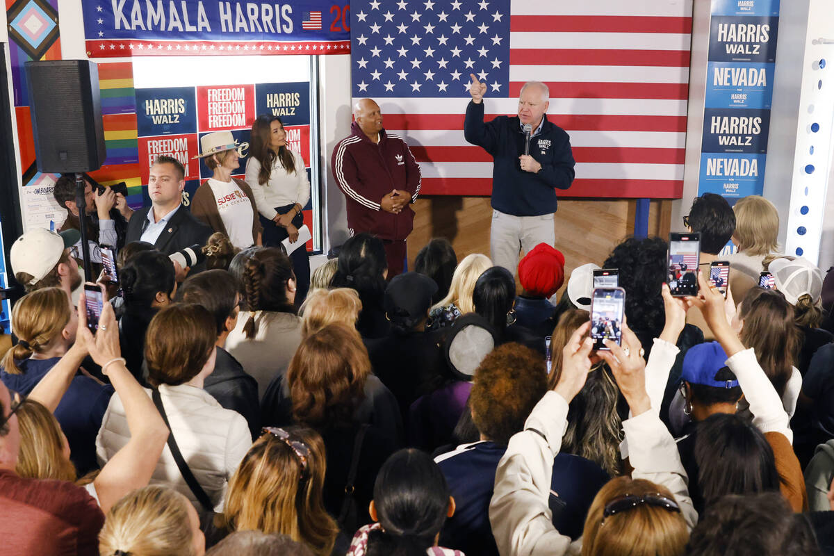 Democratic vice presidential nominee Tim Walz speaks to rally campaign volunteers during a canv ...