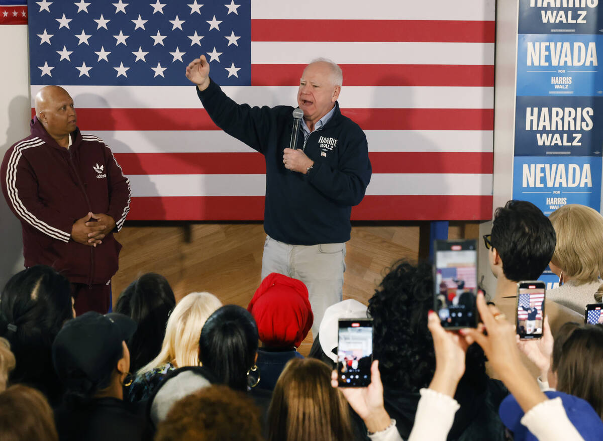 Democratic vice presidential nominee Tim Walz speaks to rally campaign volunteers during a canv ...