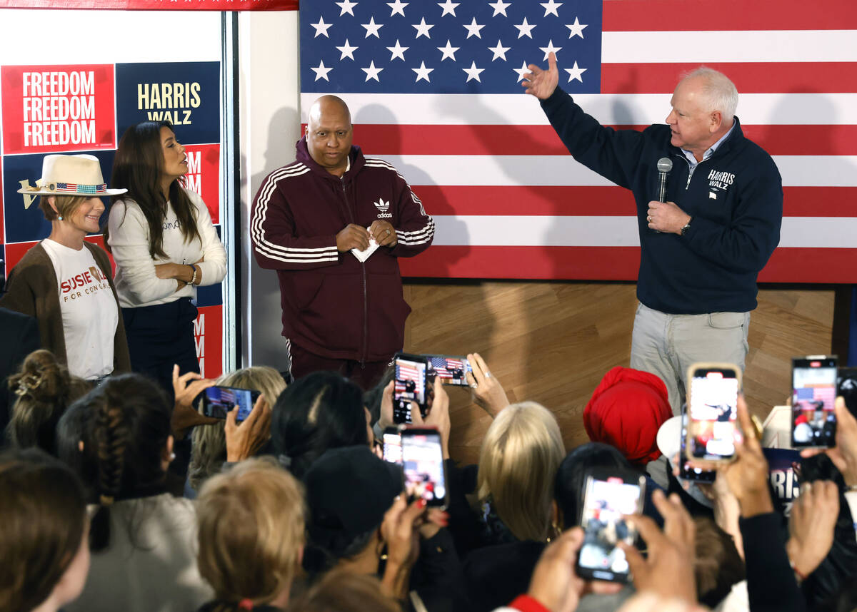 Democratic vice presidential nominee Tim Walz speaks to rally campaign volunteers during a canv ...