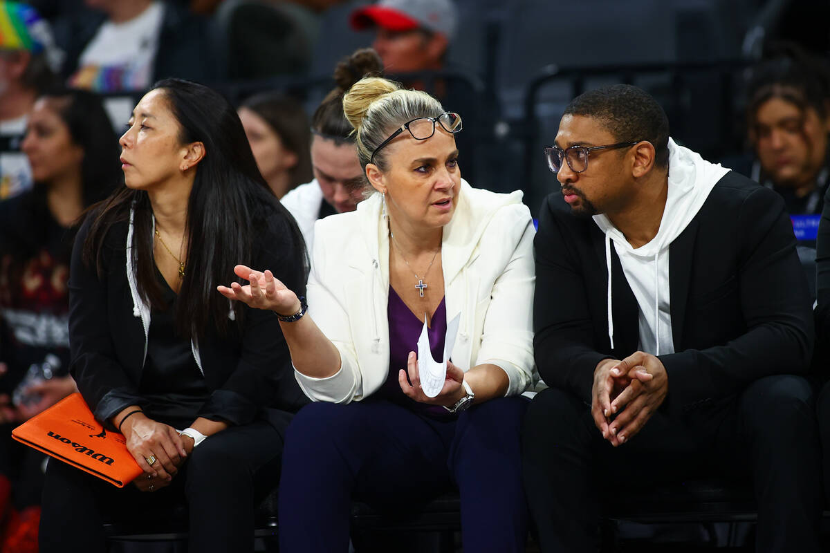 Las Vegas Aces assistant coach Natalie Nakase, left, head coach Becky Hammon, center, and assis ...