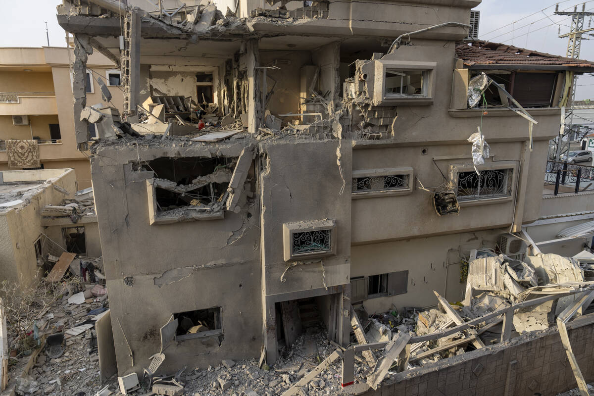 A view of a damaged home after projectiles fired from Lebanon in Tira, central Israel, Saturday ...