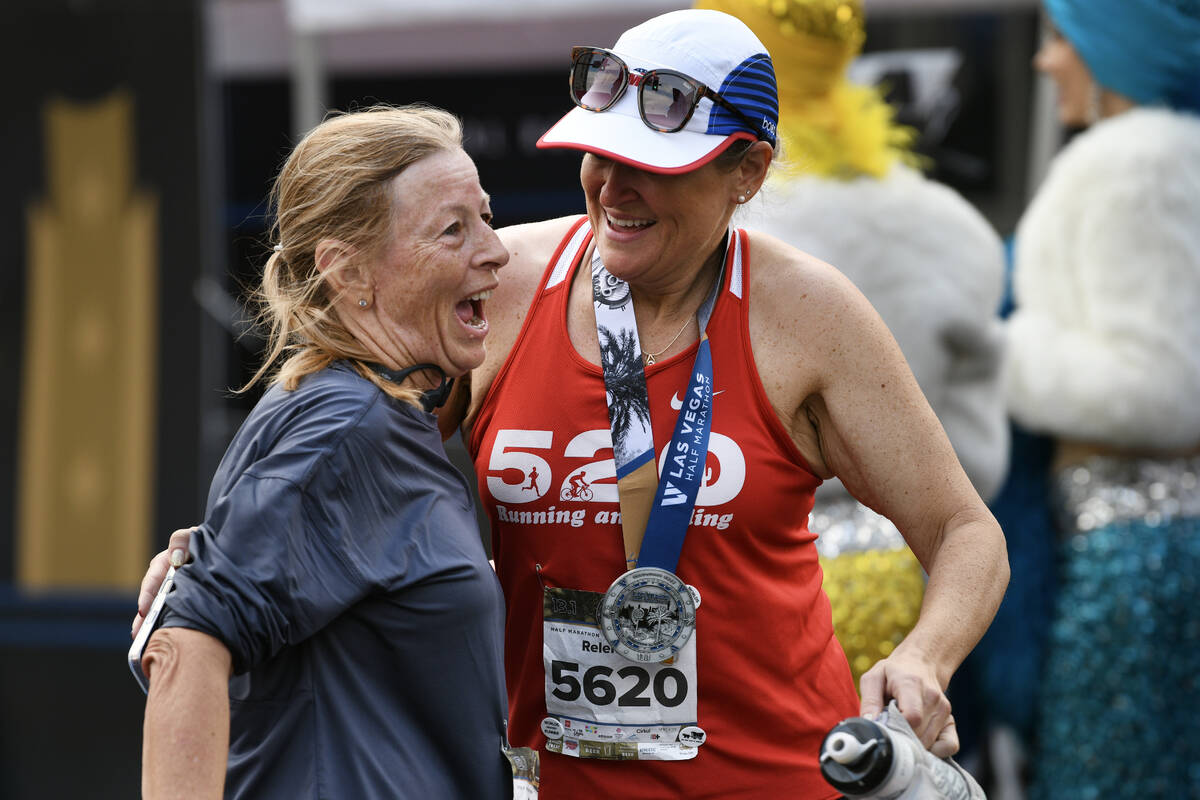 Eileen Rubelmann, left, is greeted by Brooke Streicher after finishing the Las Vegas Marathon S ...