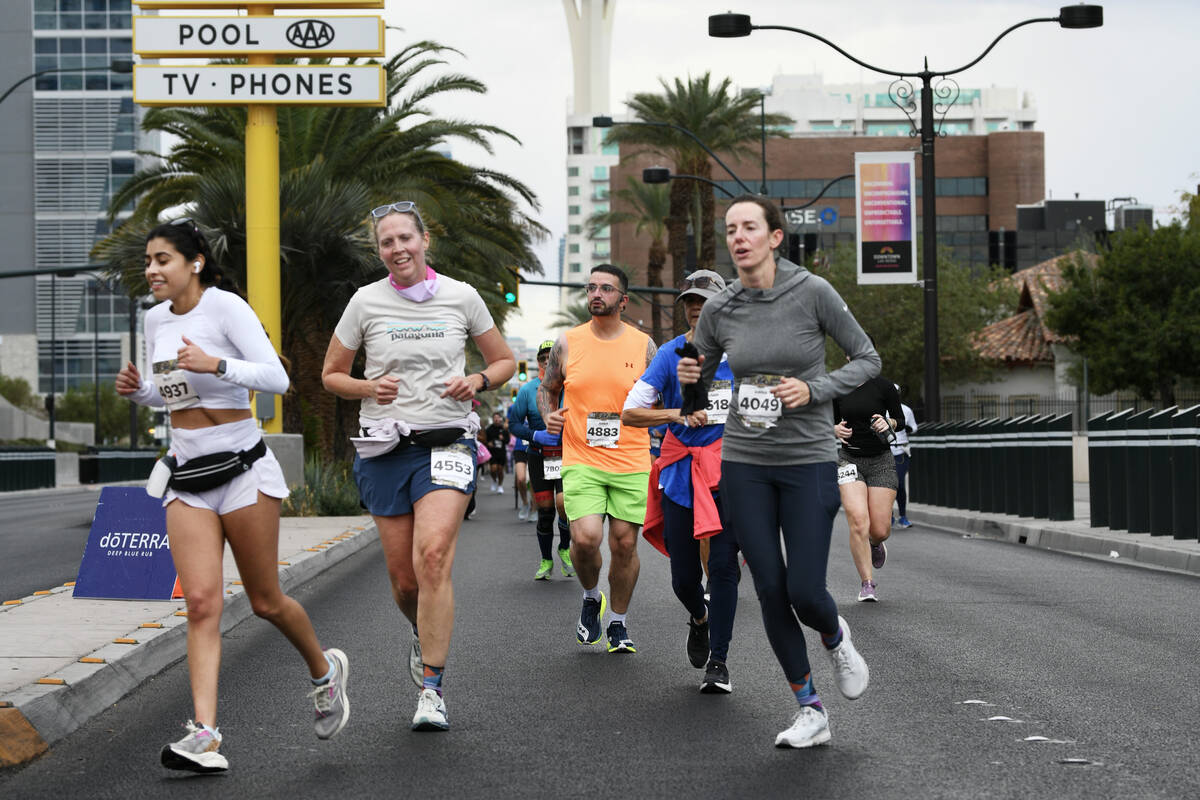 Participants enter the final mile of the Las Vegas Marathon Sunday, Nov. 3, 2024, in Las Vegas. ...