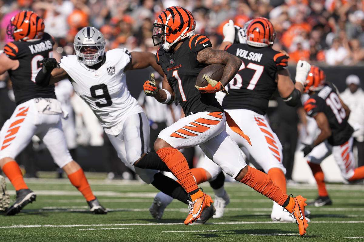 Cincinnati Bengals wide receiver Ja'Marr Chase (1) runs against Las Vegas Raiders defensive end ...