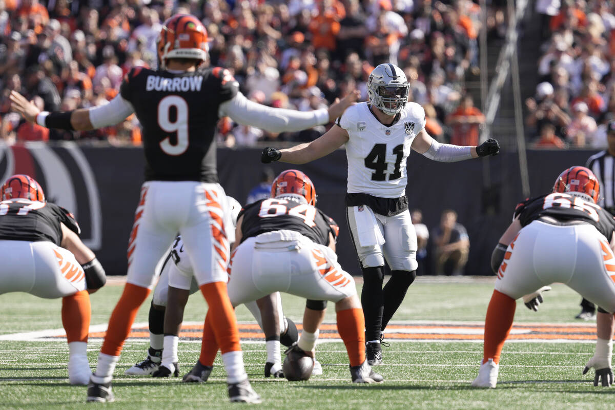 Cincinnati Bengals quarterback Joe Burrow (9) and Las Vegas Raiders linebacker Robert Spillane ...