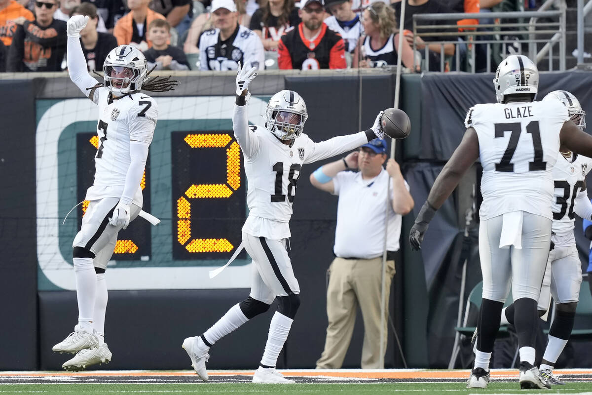 Las Vegas Raiders cornerback Jack Jones (18) celebrates after returning an interception for a t ...