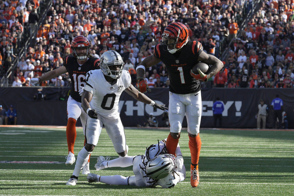 Cincinnati Bengals wide receiver Ja'Marr Chase (1) runs against Las Vegas Raiders cornerback Ja ...