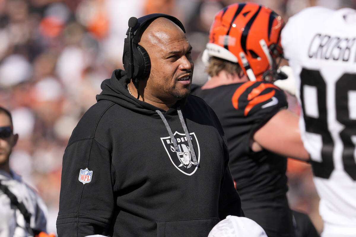 Las Vegas Raiders head coach Antonio Pierce watches from the sideline during the first half of ...