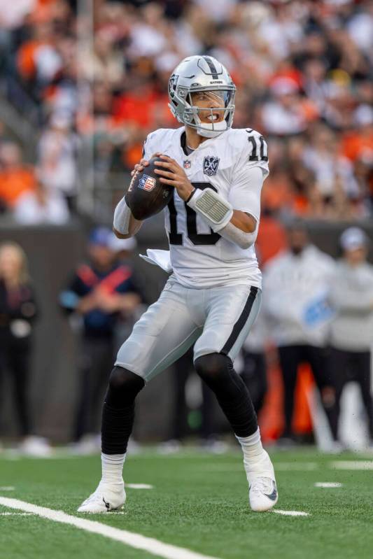 Las Vegas Raiders quarterback Desmond Ridder (10) drops back to pass against the Cincinnati Ben ...