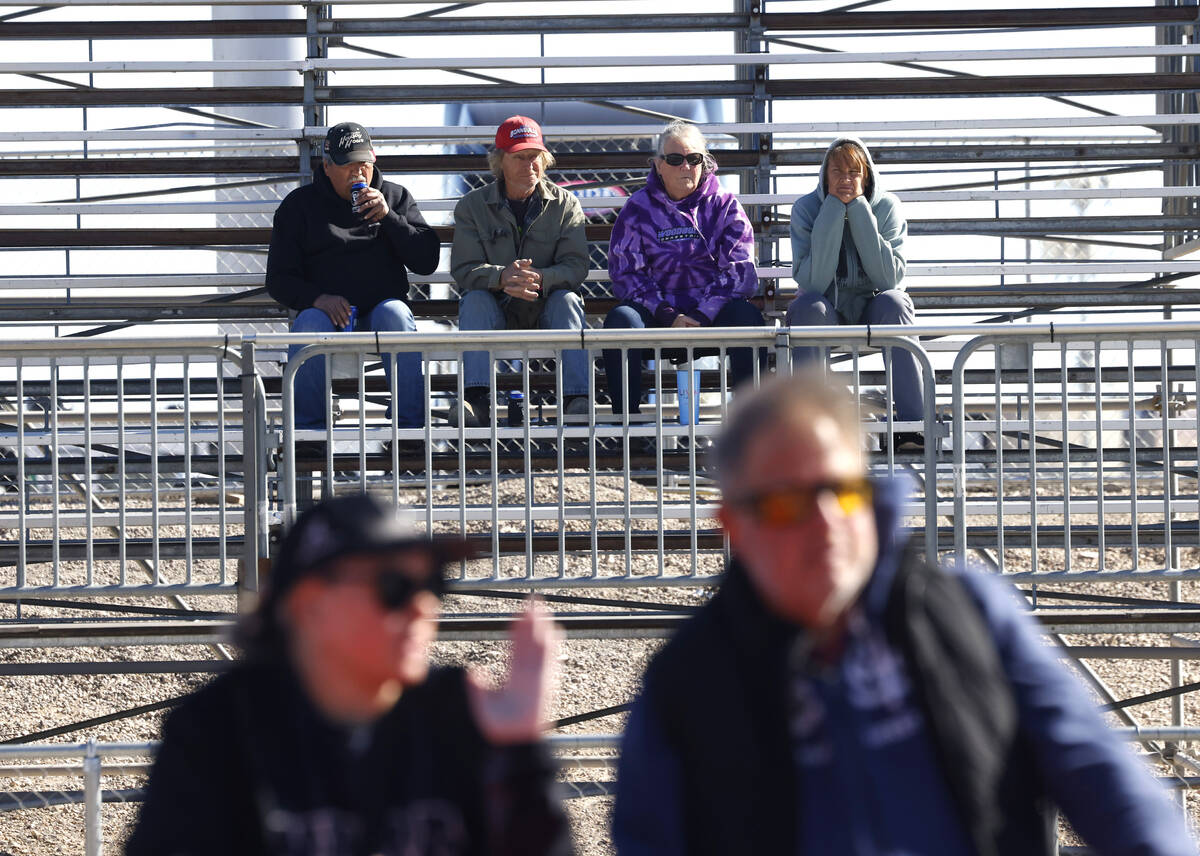 Fans handled up as the watch Top Fuel drivers take off during the semifinals of the NHRA Nation ...