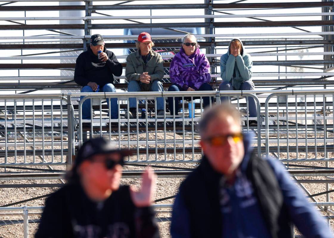 Fans handled up as the watch Top Fuel drivers take off during the semifinals of the NHRA Nation ...