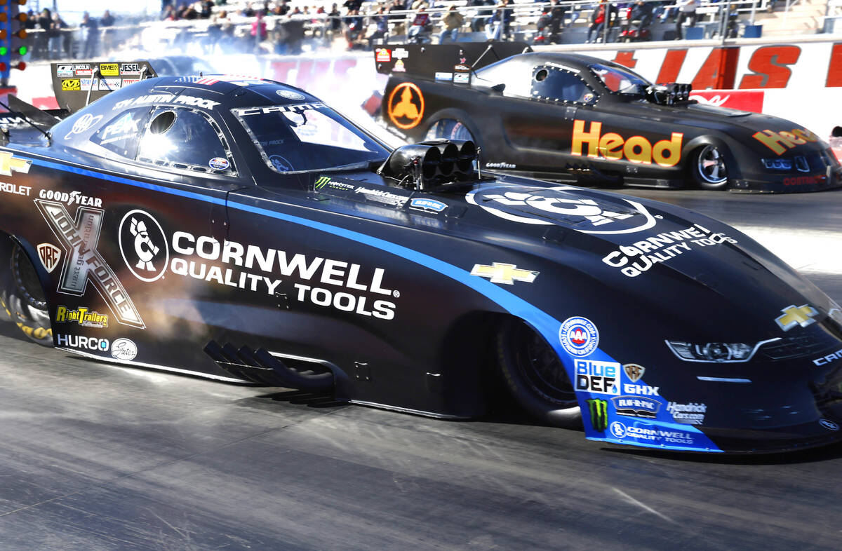 Funny car drivers Austin Prock, left, and Blake Alexander take off during the semifinals of the ...