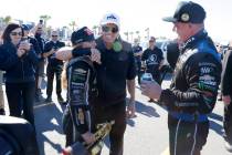 John Force hugs his daughter Top Fuel driver Brittany, left, after winning the NHRA Nationals a ...