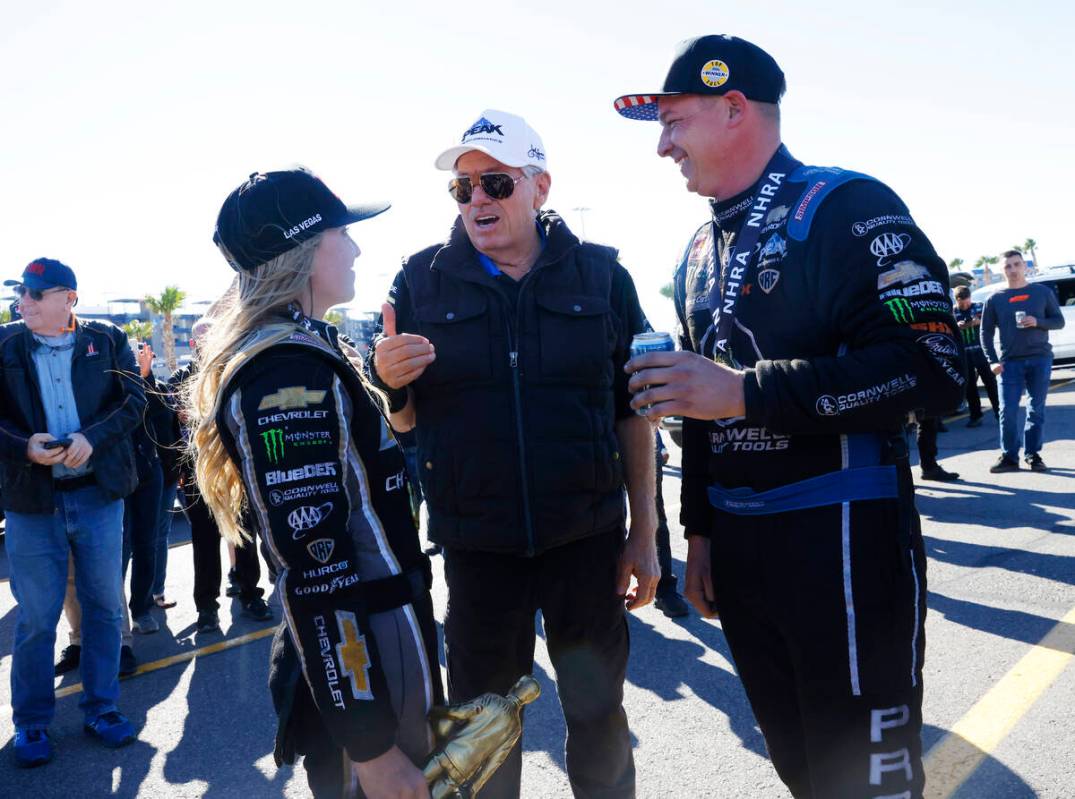 John Force talks to his daughter Top Fuel driver Brittany, left, after winning the NHRA Nationa ...