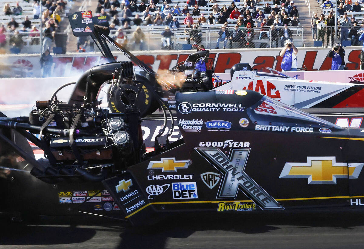 Top Fuel drivers Brittany Force, left, and Doug Kalitta take off during the final of the NHRA N ...