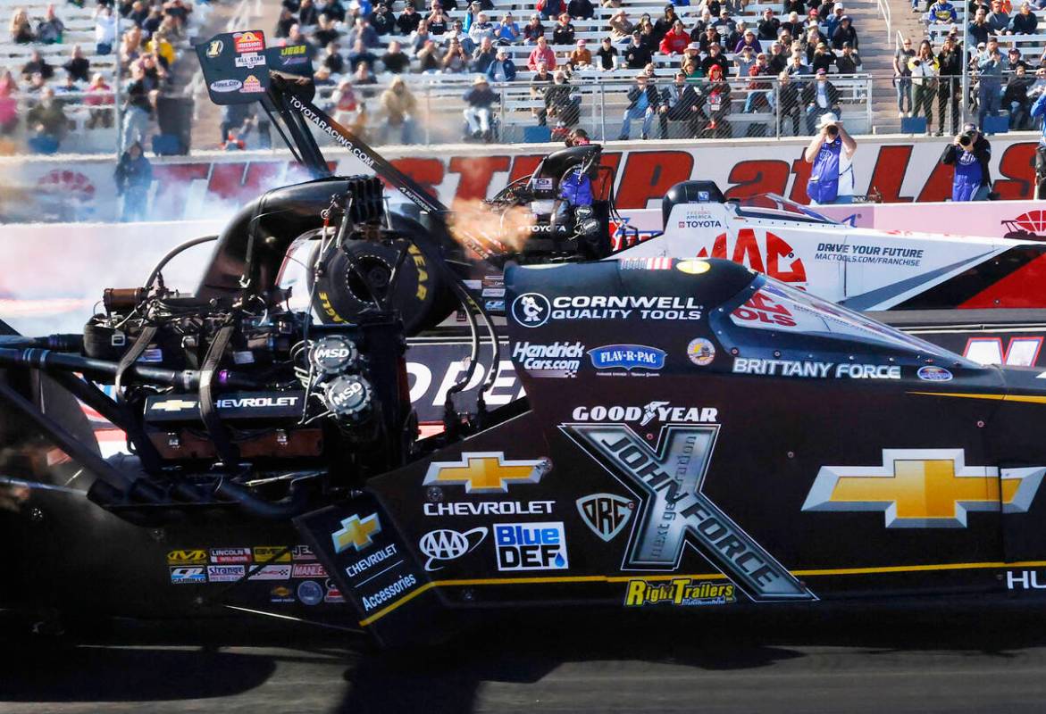 Top Fuel drivers Brittany Force, left, and Doug Kalitta take off during the final of the NHRA N ...