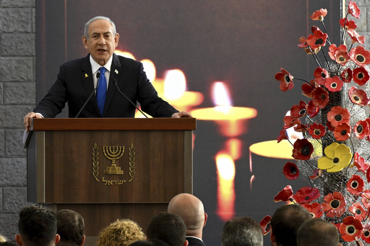 Israeli Prime Minister Benjamin Netanyahu speaks at a memorial ceremony for those killed by Ham ...