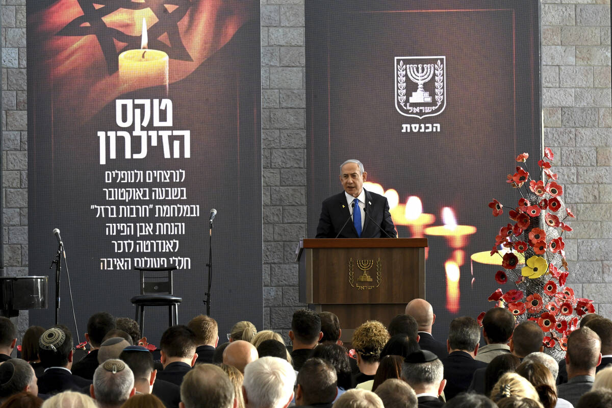 Israeli Prime Minister Benjamin Netanyahu speaks at a memorial ceremony for those killed by Ham ...