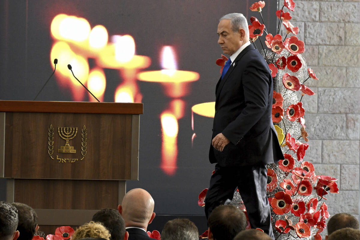 Israeli Prime Minister Benjamin Netanyahu arrives for a memorial ceremony for those killed by H ...