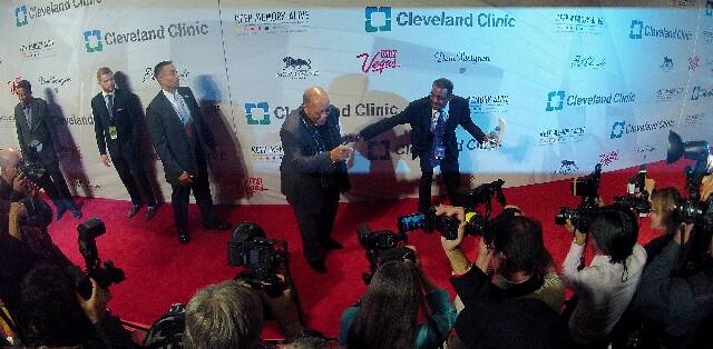 Honoree Quincy Jones, middle, poses for press photographers Saturday during the red carpet for ...