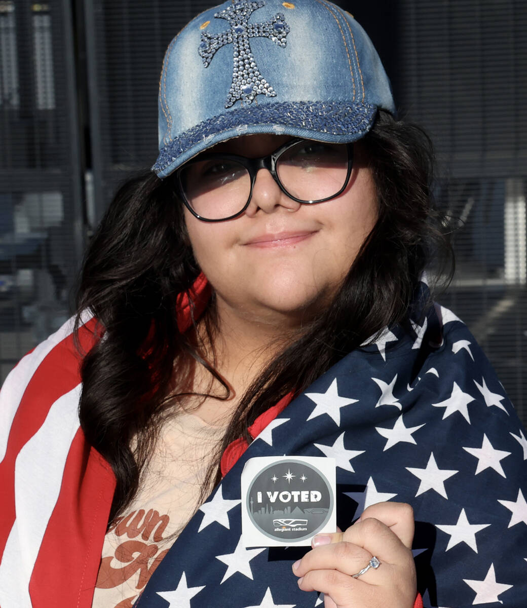 Ammy Rivera of Las Vegas shows her unique Allegiant Stadium “I VOTED” sticker aft ...