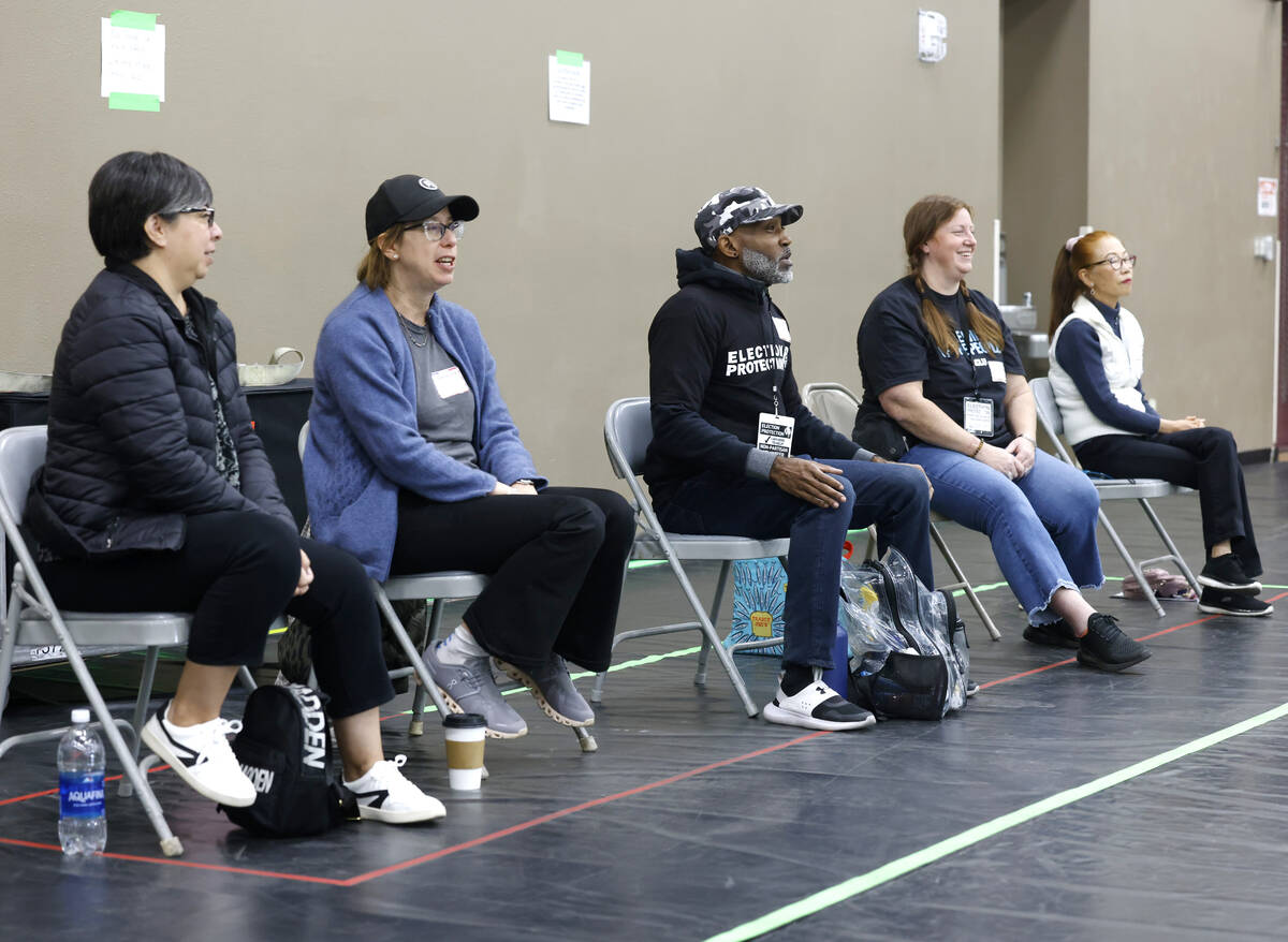 Election observers watch as voters cast their votes at Desert Breeze Community Center Tuesday, ...