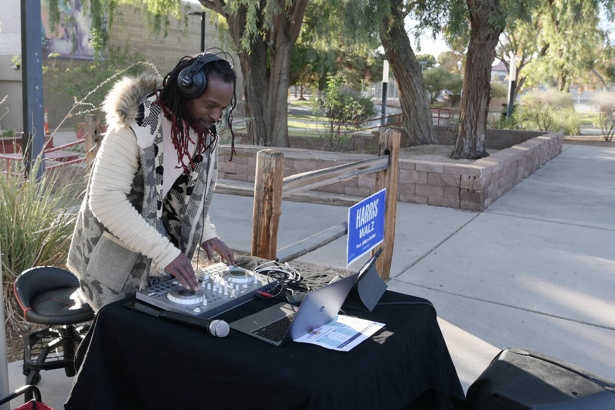 DJ Nice from DJs at the Polls plays music outside the Winchester Dondero Cultural Center Tuesda ...