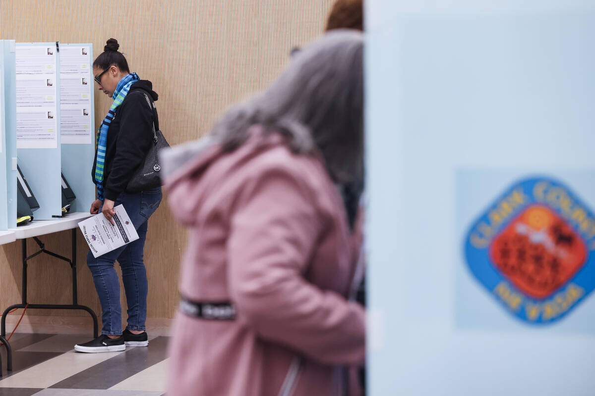 Voters cast their ballots at a vote center at the East Las Vegas Library, Tuesday, Nov. 5, 2024 ...