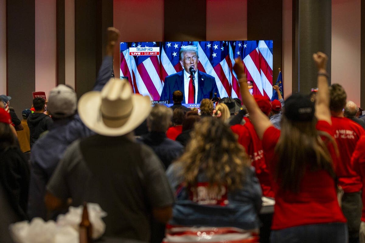 Supporters celebrate as Donald Trump speaks after re-elected President during the GOP election ...