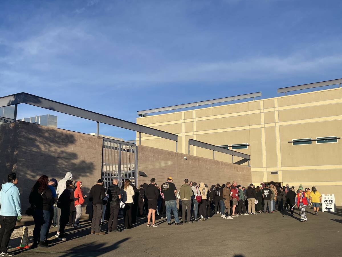 People wait outside Desert Breeze Community Center just before polls opened Tuesday to cast the ...