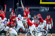 UNLV defensive lineman Fisher Camac (28) elevates for a kick block attempt by the Boise State B ...