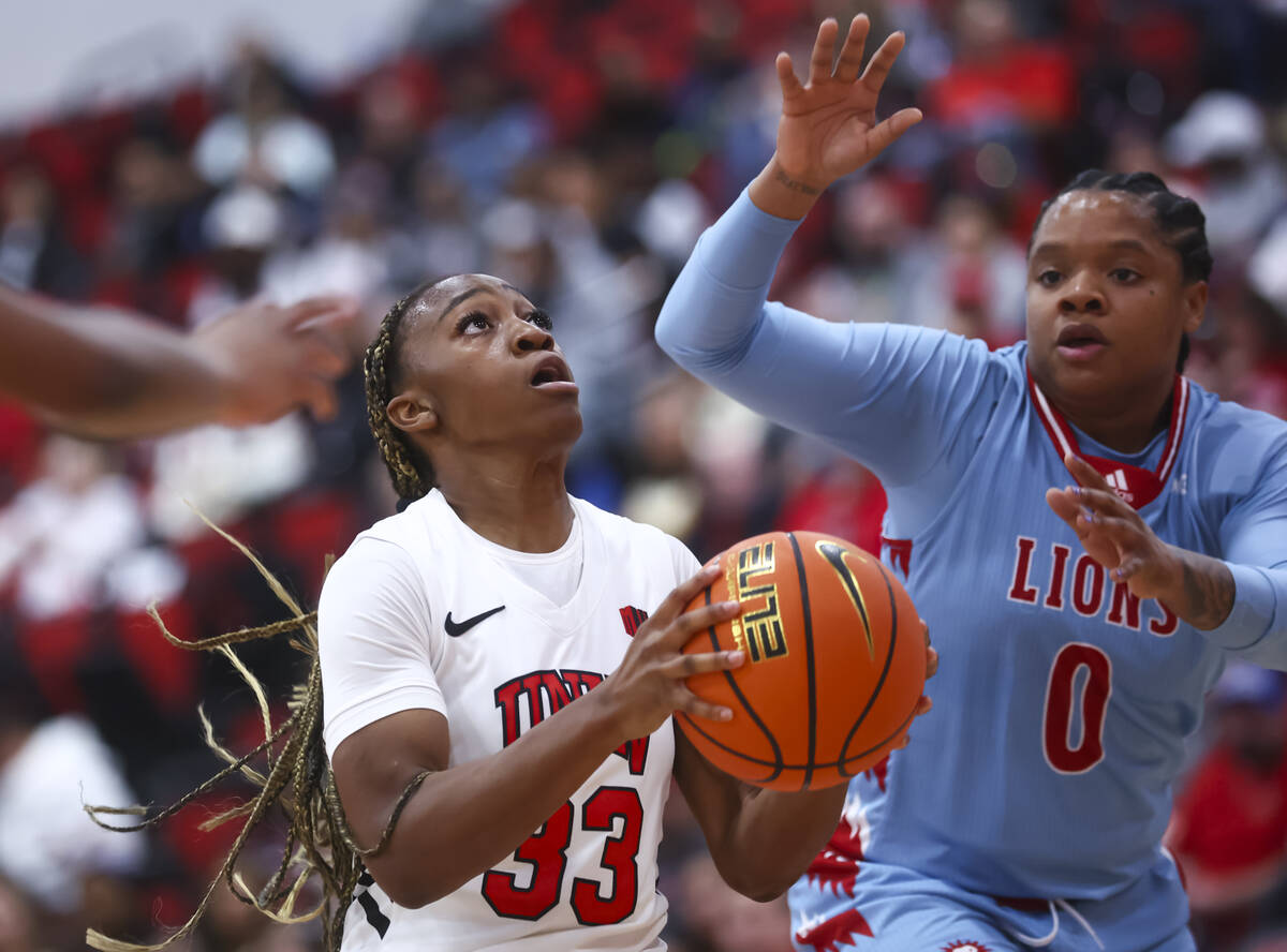 UNLV Lady Rebels guard Amarachi Kimpson (33) looks to shoot as Loyola Marymount Lions guard Bra ...