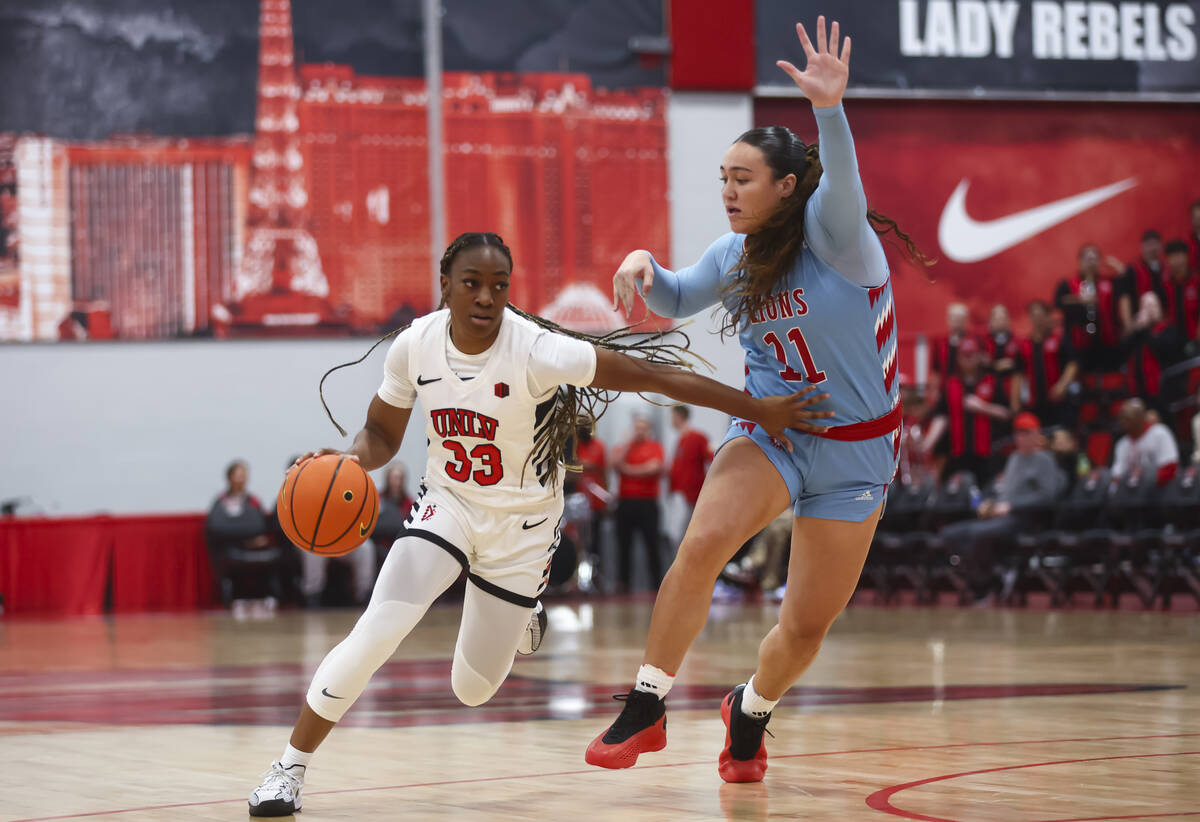 UNLV Lady Rebels guard Amarachi Kimpson (33) drives the ball against Loyola Marymount Lions for ...