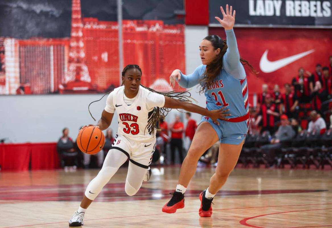 UNLV Lady Rebels guard Amarachi Kimpson (33) drives the ball against Loyola Marymount Lions for ...