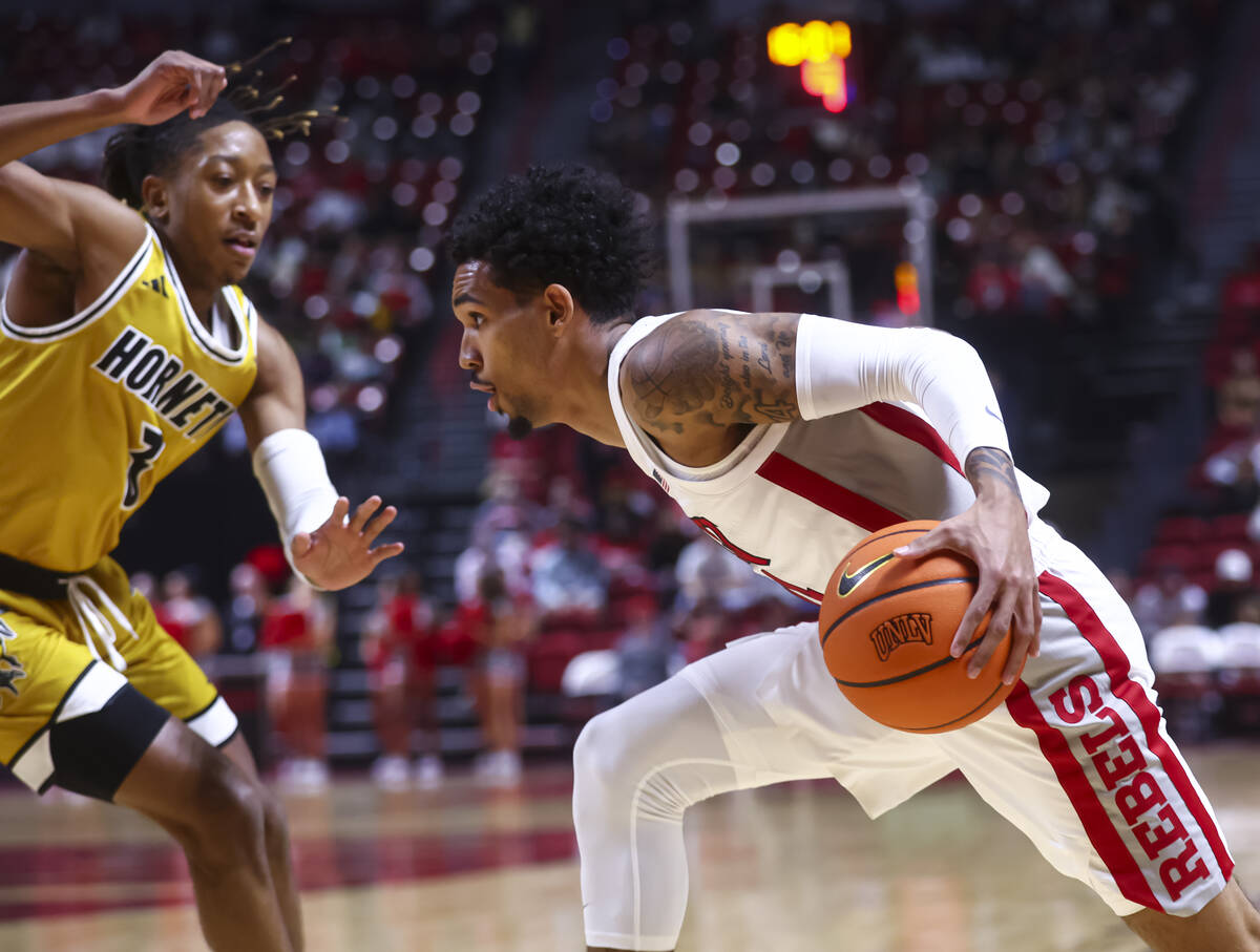 UNLV Rebels guard Jailen Bedford (14) drives to the basket against Alabama State Hornets guard ...