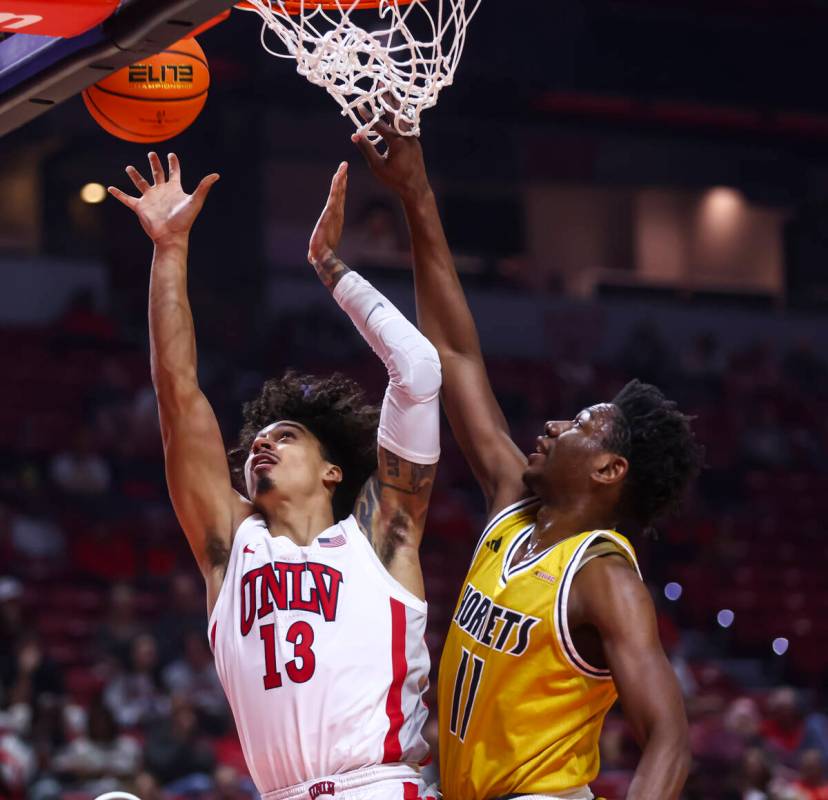 UNLV Rebels guard Brooklyn Hicks (13) goes to the basket against Alabama State Hornets guard Mi ...