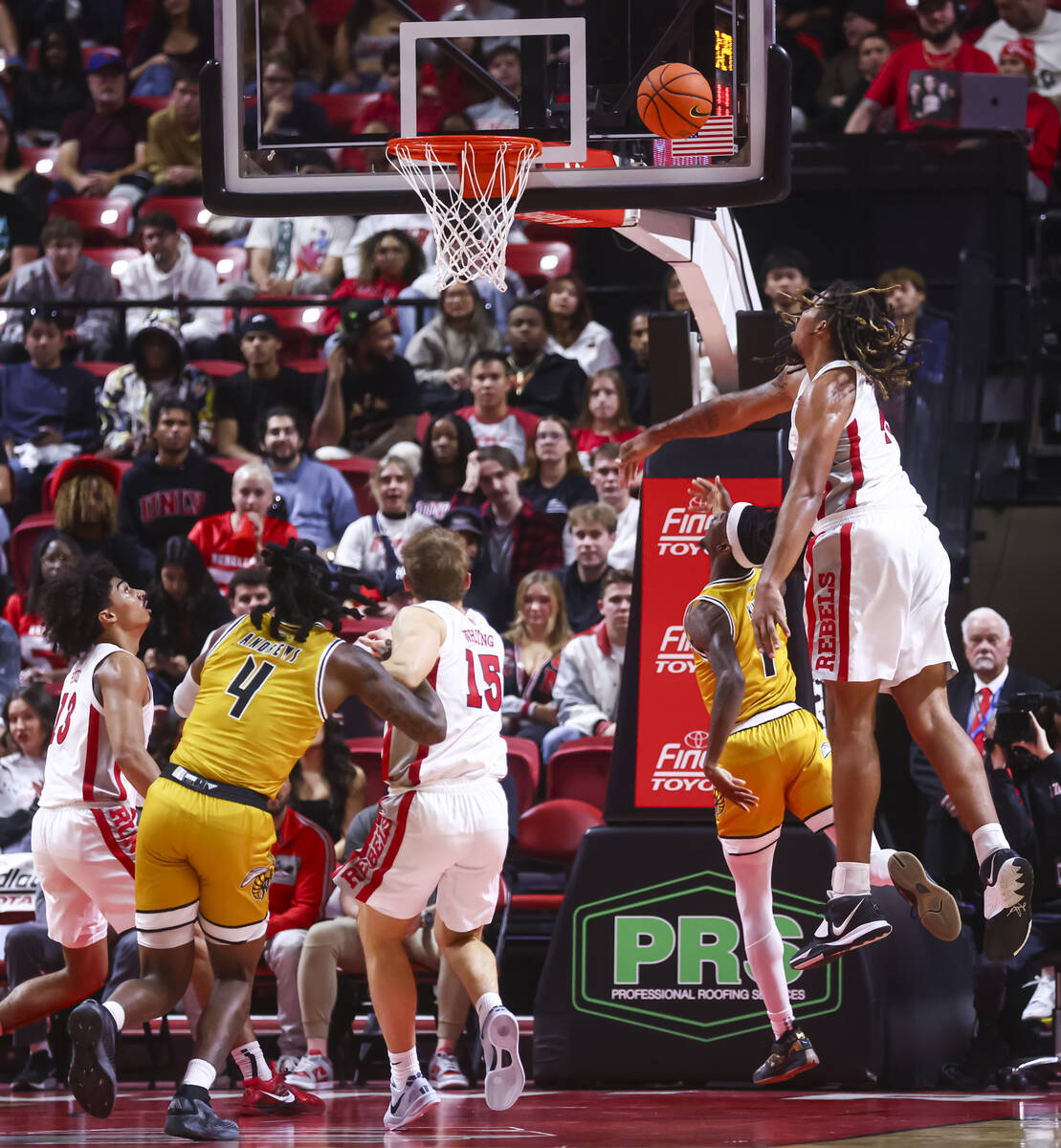 UNLV Rebels forward Jeremiah Cherry (45) tries to stop a shot from Alabama State Hornets guard ...