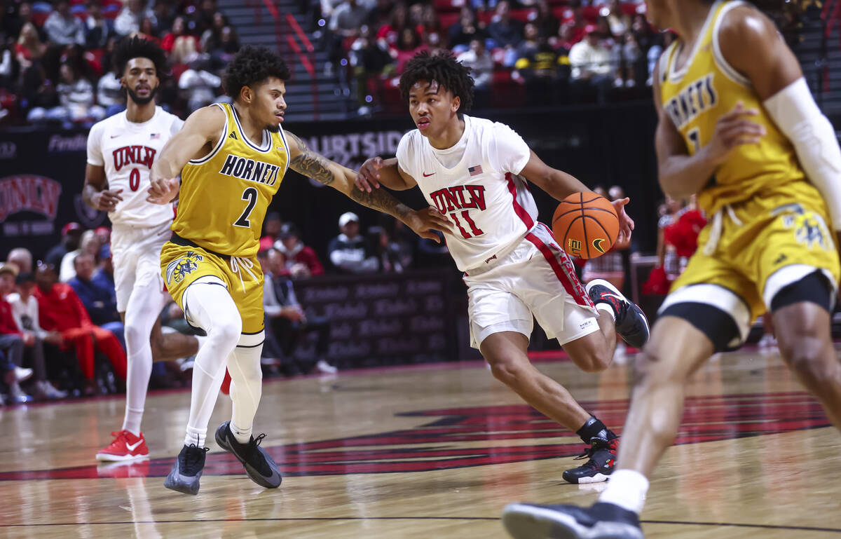 UNLV Rebels guard Dedan Thomas Jr. (11) drives to the basket against Alabama State Hornets guar ...